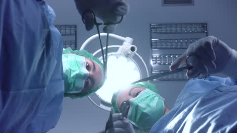 women performing surgery in hospital together