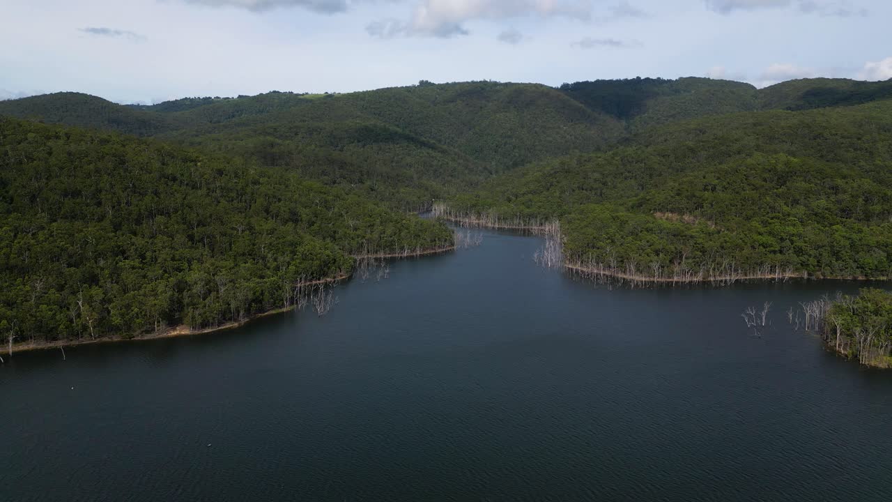 Right to left aerial views of Advancetown Lake near the Western Boat Ramp on the Gold Coast Hinterland.