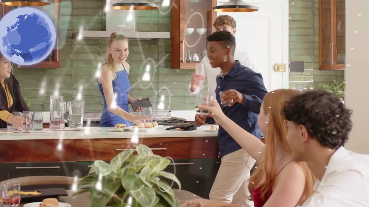 Man gesturing at island, starting toast, woman holding phone, group clapping, tech overlay rising