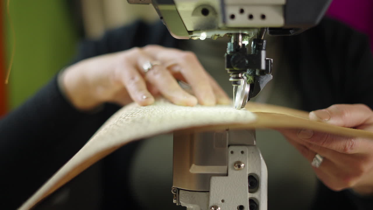 Sewing machine working on fabric