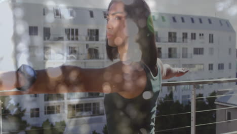 animación de luces brillantes sobre una mujer biracial practicando yoga