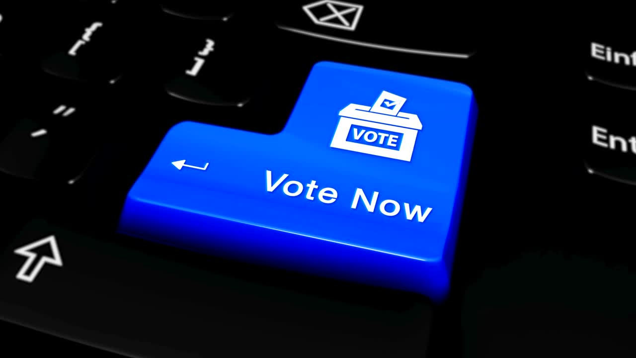 Vote Now Round Motion On Computer Keyboard Button.