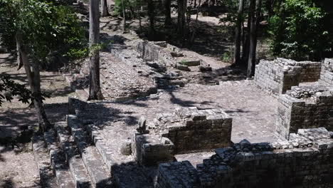 tilt pan of excavated ancient mayan temple ruins at copan, honduras