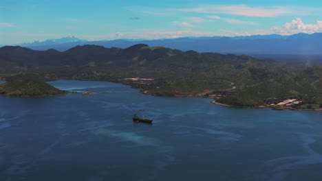 Ela-Beach-Port-Moresby-Papa-Papua-New-Guinea-Aerial-drone-oil-rig-boat-blue-sky-sunny-morning-bay-coastline-hills-PNG-Capital-City-Central-Business-District-wharf-Harbor-Idlers-Bay-circle-right