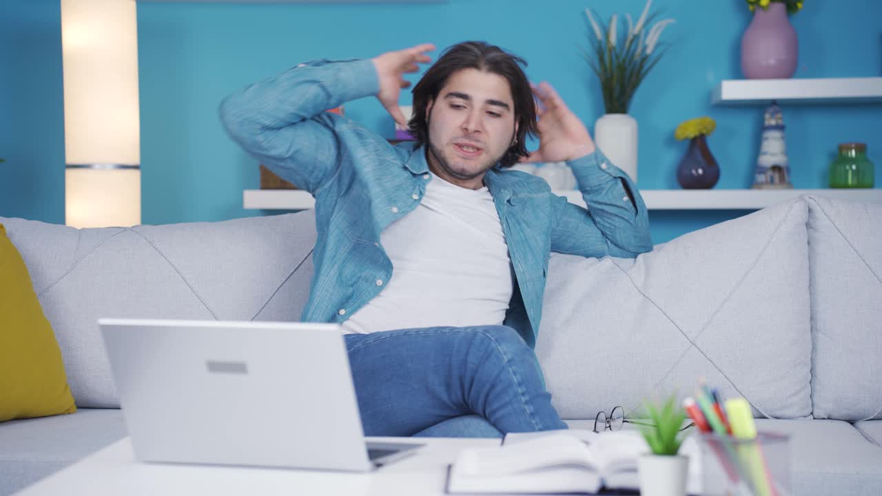 Seeing your failure on the laptop, the man is frustrated.