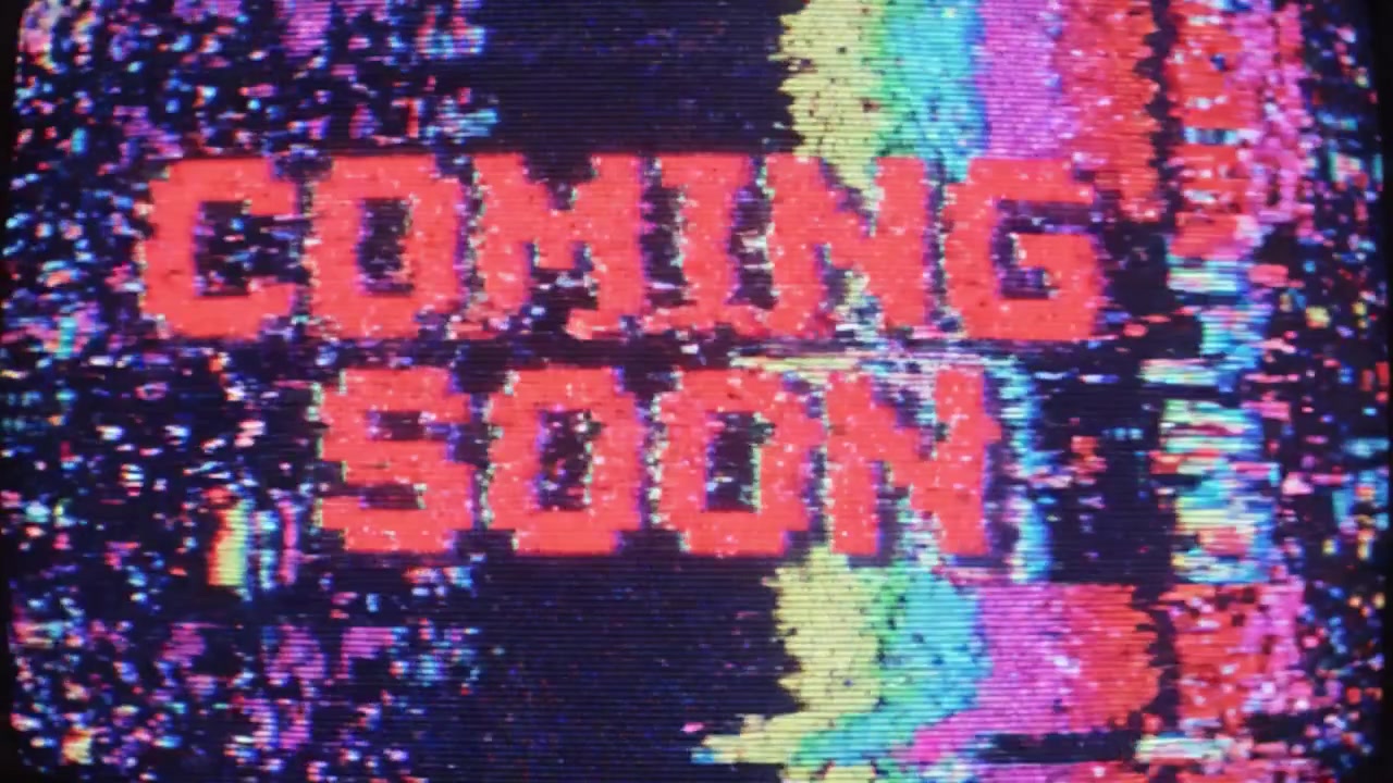 A captivating visual display featuring a 'Coming Soon' announcement, highlighted with colorful glitch effects against a dynamic background, creating a vibrant anticipation for the upcoming content.