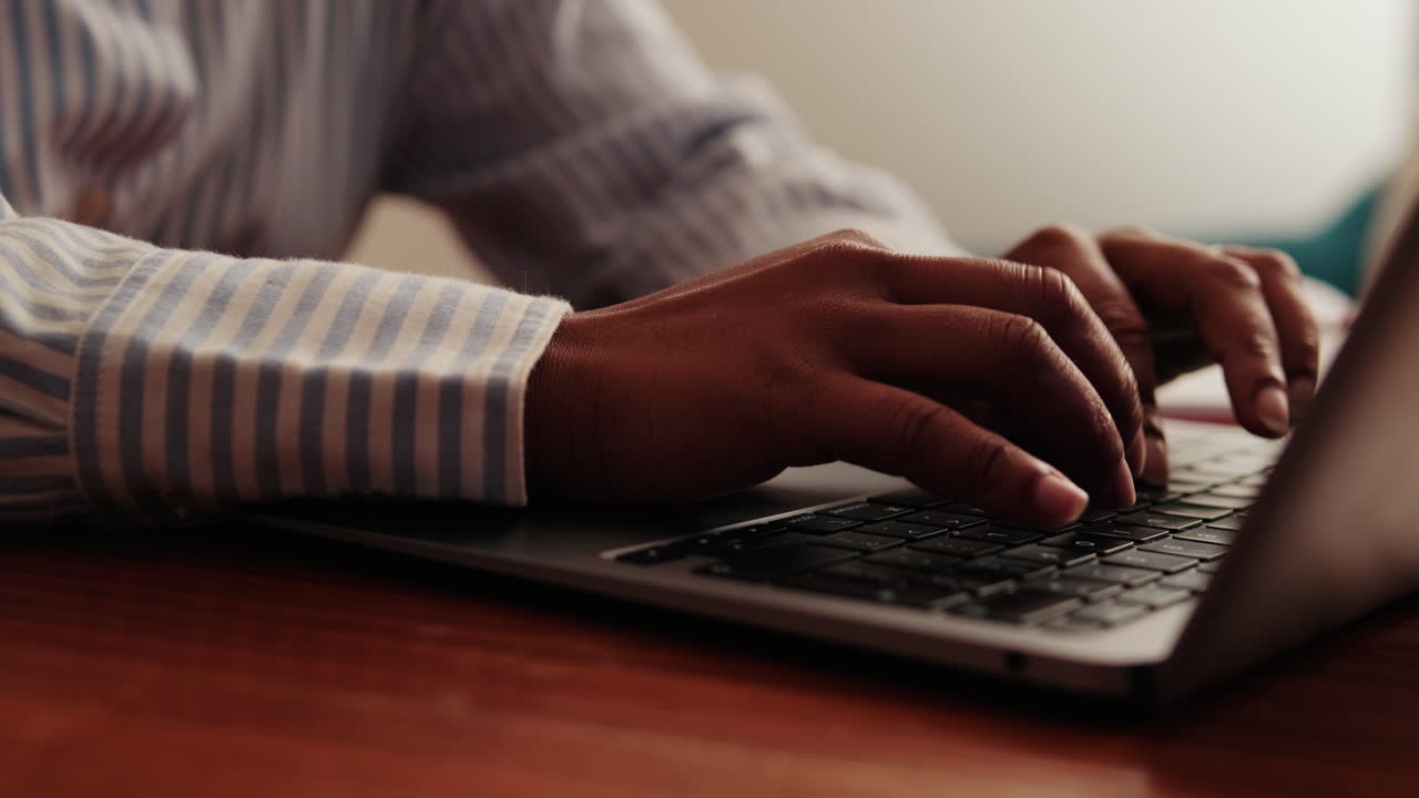 Woman Typing on Laptop Keyboard