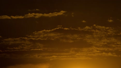 timelapse at cloudy sunset with zoom of sun