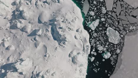 drone over sea and ice of ilulissat icefjord