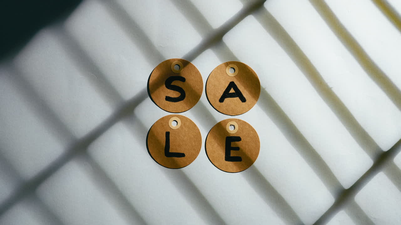 Sale written on a background and discounts tags falling on table Black Friday