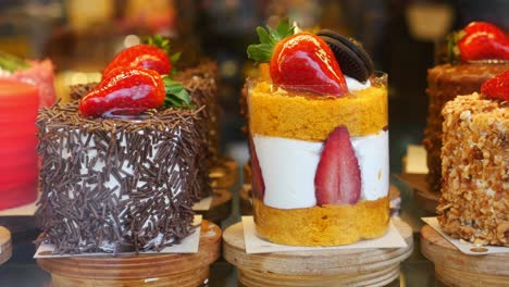 a close-up of delicious mini cakes decorated with strawberries