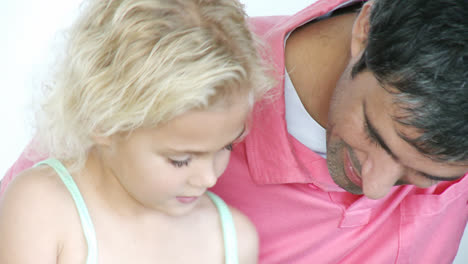 Father-and-little-girl-doing-homework-together