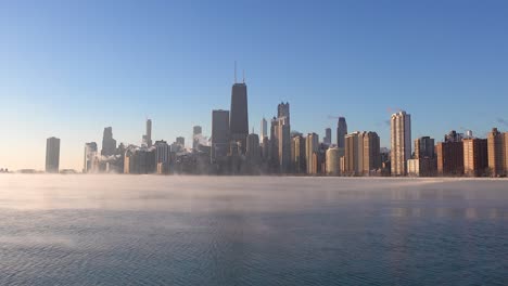 timelapse of sea smoke on lake michigan with chicago skyline in the morning sunlight