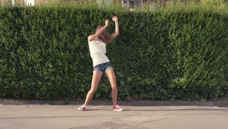 funny woman dancing loop girl having fun celebrating with dance in street lively female dancer outdoors 4k