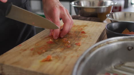 Caucasian-male-chef-cutting-vegetables