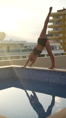 yoga poses on rooftop with pool reflection