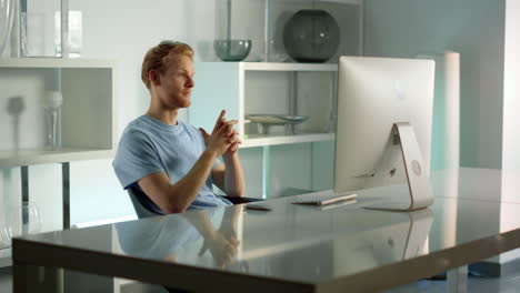 smiling businessman having video conference with corporate team at home office.