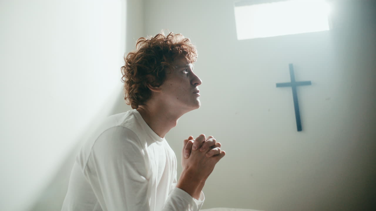 Psychiatric Patient Praying Deeply to God in Asylum