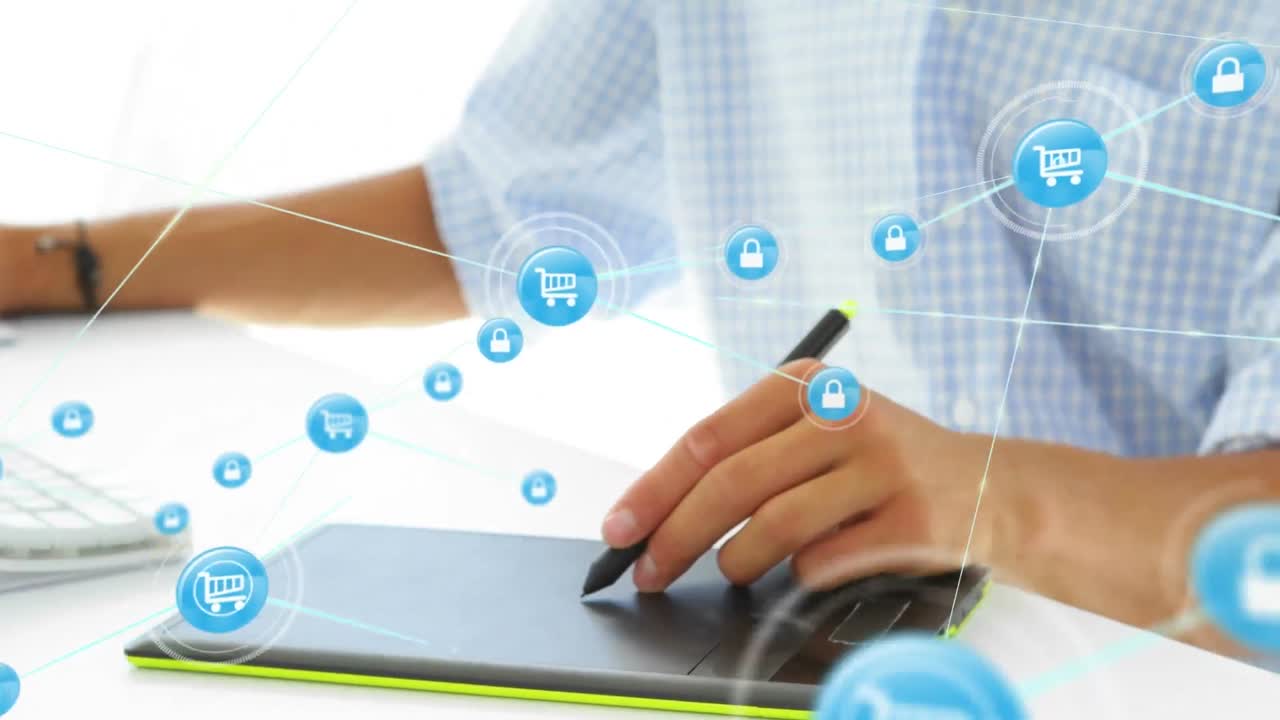 animación de iconos conectados sobre artista masculino caucásico dibujando en una tableta gráfica en la oficina