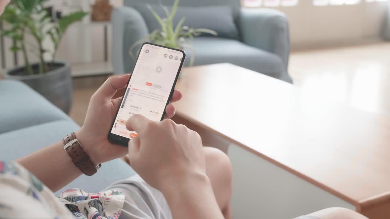 Man Looks At The Goods In The Online Clothing Store. People Using Smartphone, Online Shopping