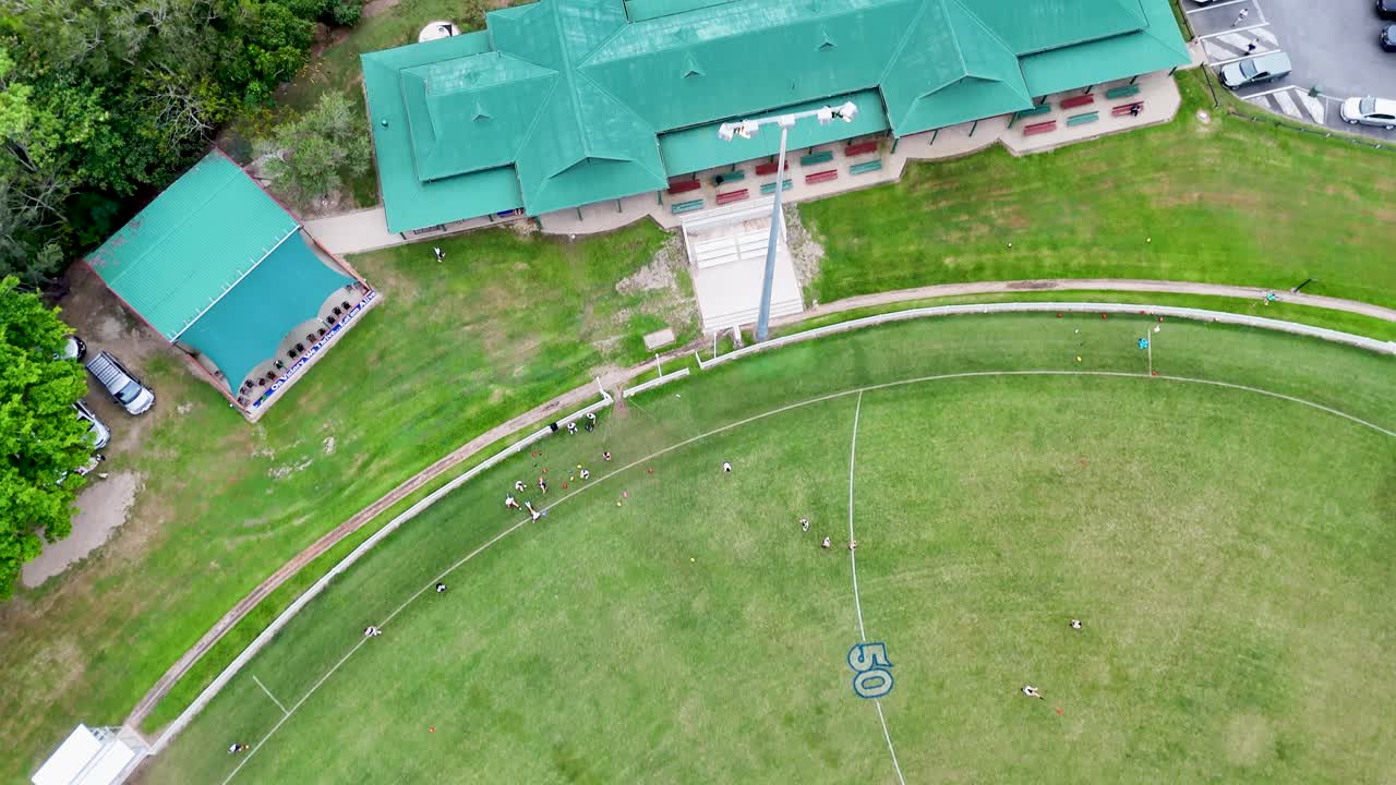 Drone footage captures sports fields and facilities in Port Douglas, showcasing a vibrant outdoor recreational area
