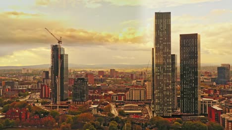 Aerial-drone-fly-over-Manchester-Deansgate-Square-city-high-rise-skyscrapers,-England