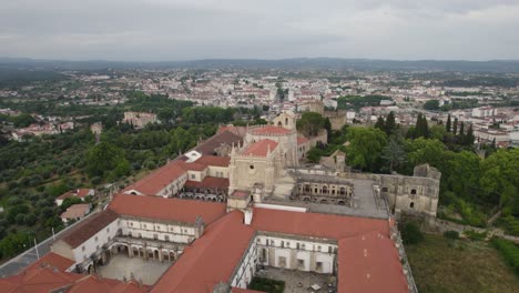 Roman-catholic-monastery-in-Tomar,-Portugal,-aerial-orbit-on-a-cloudy-day