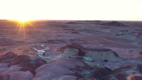 sunbeams at sunrise illuminating mars research station area, hanksville