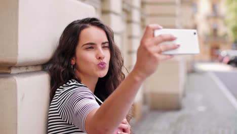 young woman making a selfie in the city