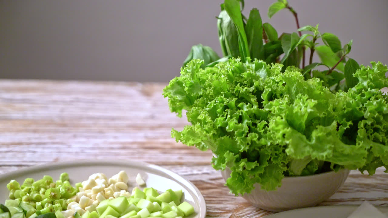 Vietnamese pork  meatball with vegetables wraps (Nam-Neaung or Nham Due) - vietnamese traditional food culture