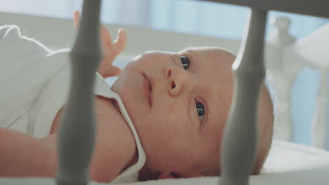 baby lying in crib