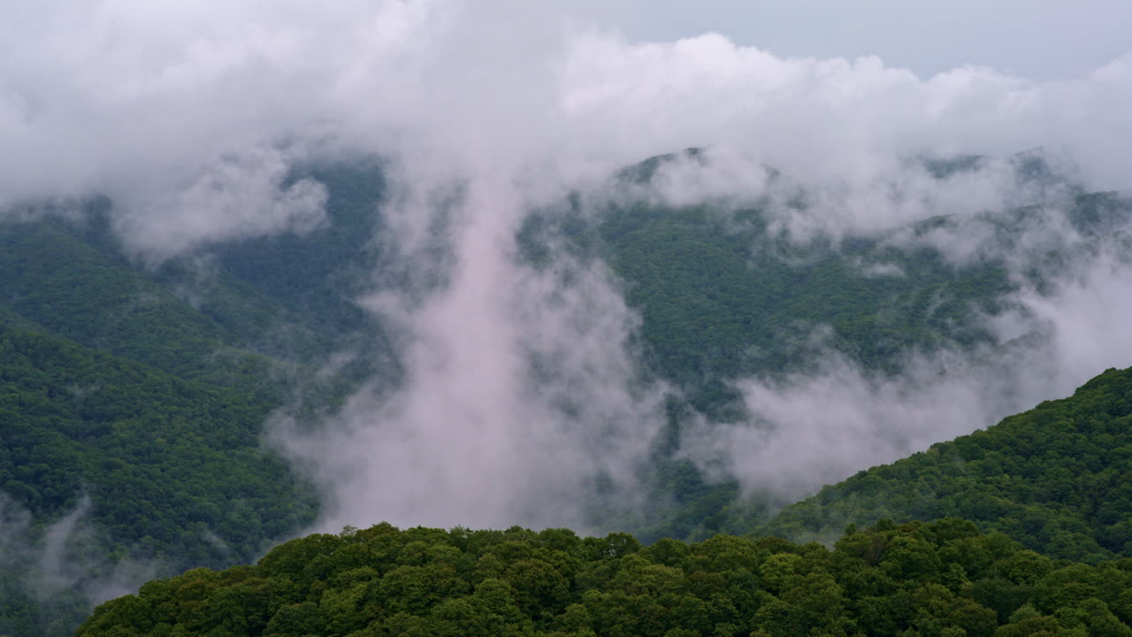 Cinematic flyover of the Smoky Mountains in thick morning fog