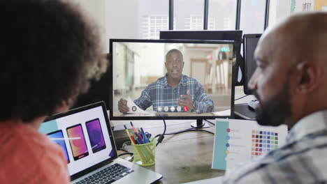 african american business people on video call with african american male colleague on screen