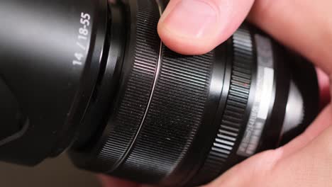 focusing lens of digital camera. camera lens zoom. changing focal length. close-up camera focus focusing and shooting. concept of proffesional service for photographic or filmmaker equipment. close up