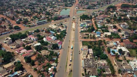 Cinematic-Aerial-View-of-African-City-road-traffic,-Lomé,-West-Africa