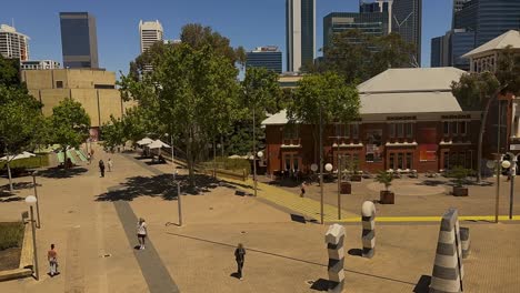 city park with modern buildings and art installation