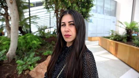 good-looking woman being mad to someone with intense eyes looking straight to the camera