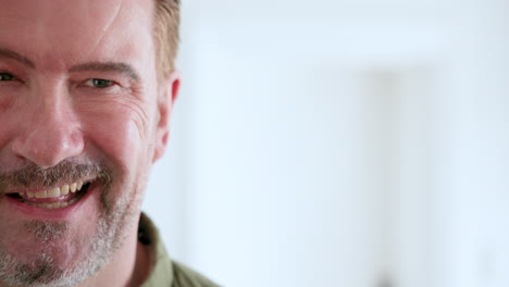 senior man smiling and embracing festive holiday spirit at home with decorations, copy space