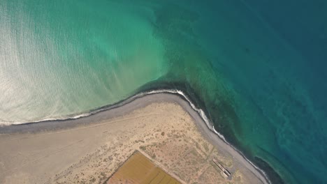 Coastline-of-the-Atlantic-ocean-on-La-Graciosa-island-with-water-gently-hitting-the-edge-of-the-beach