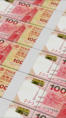 vídeo vertical de billetes de 100 dólares de hong kong impresos por una prensa de dinero