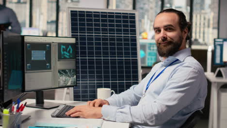 smiling sustainability specialist develops clean energy solutions