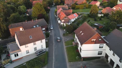 drone shoot following a car in the urban village