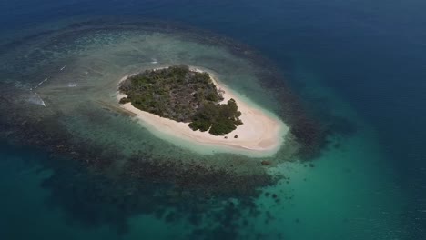 Establishing-aerial-shot-of-beautiful,-sunlit,-tiny-island,-Cayo-Peraza,-Morrocoy-National-Park,-Venezuela,-South-America