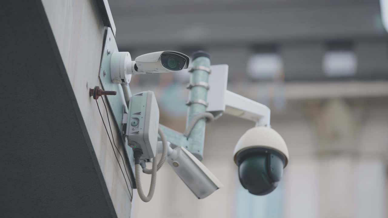 Multiple security cameras mounted on a building exterior
