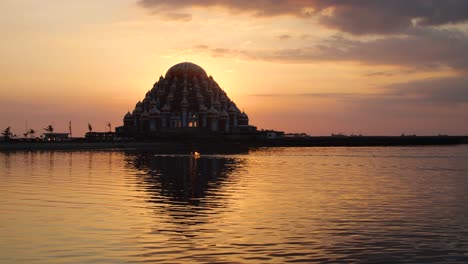 sun setting behind 99 dome mosque