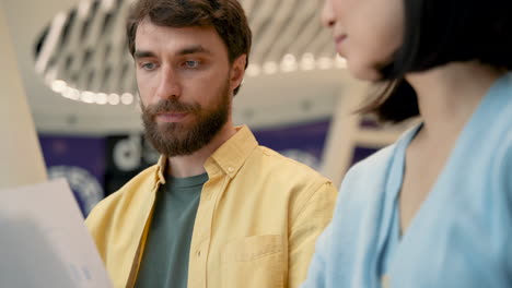 a man has a business meeting in a coffe shop with an unrecognizable young woman