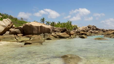 beautiful sunny day on peaceful beach on la digue, seychelles