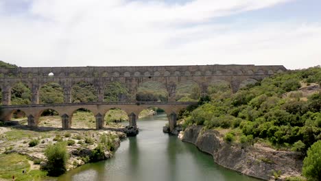 pont du gard roman aqueduct bridge built in the first century ad in vers southern france, aerial dolly in shot