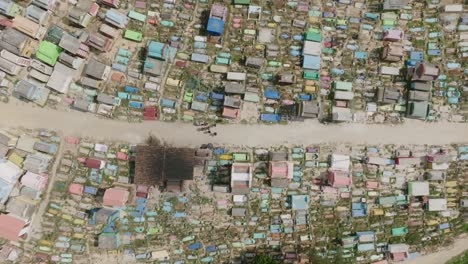 Top-down-aerial-footage-over-a-path-that-cuts-through-a-colorful-cemetery-in-the-city-of-Chichicastenango-in-northern-Guatemala