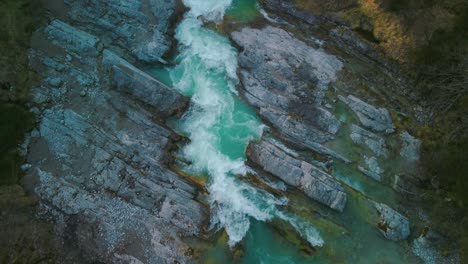 alps mountain river aerial cinemagraph seamless video loop of a scenic and idyllic canyoning waterfall with fresh natural blue water in the bavarian austrian alps, flowing along canyon forest trees. 4k uhd. rissach tyrol austria engtal ahornboden